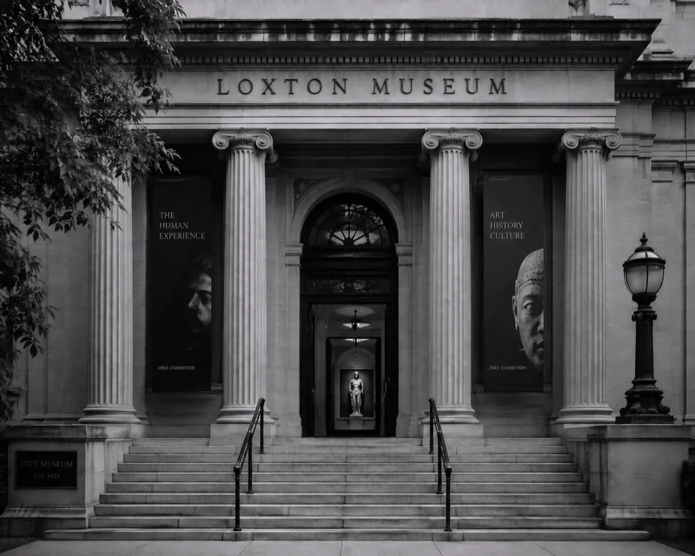 A donor-wall statue representing the museum’s patrons